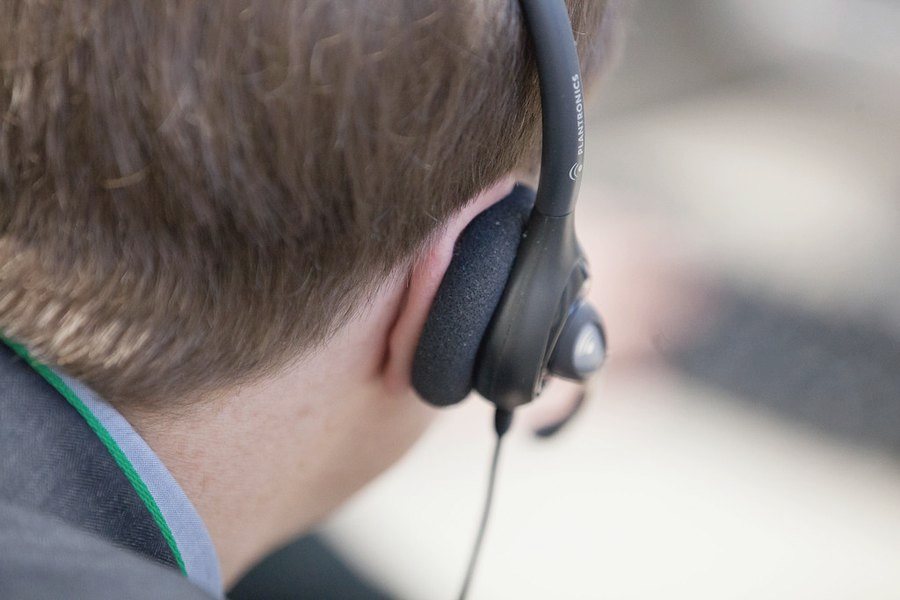 A person wearing a telephone headset