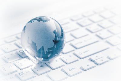 A glass globe resting on a keyboard