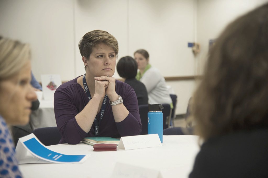 A participant listening at a town hall